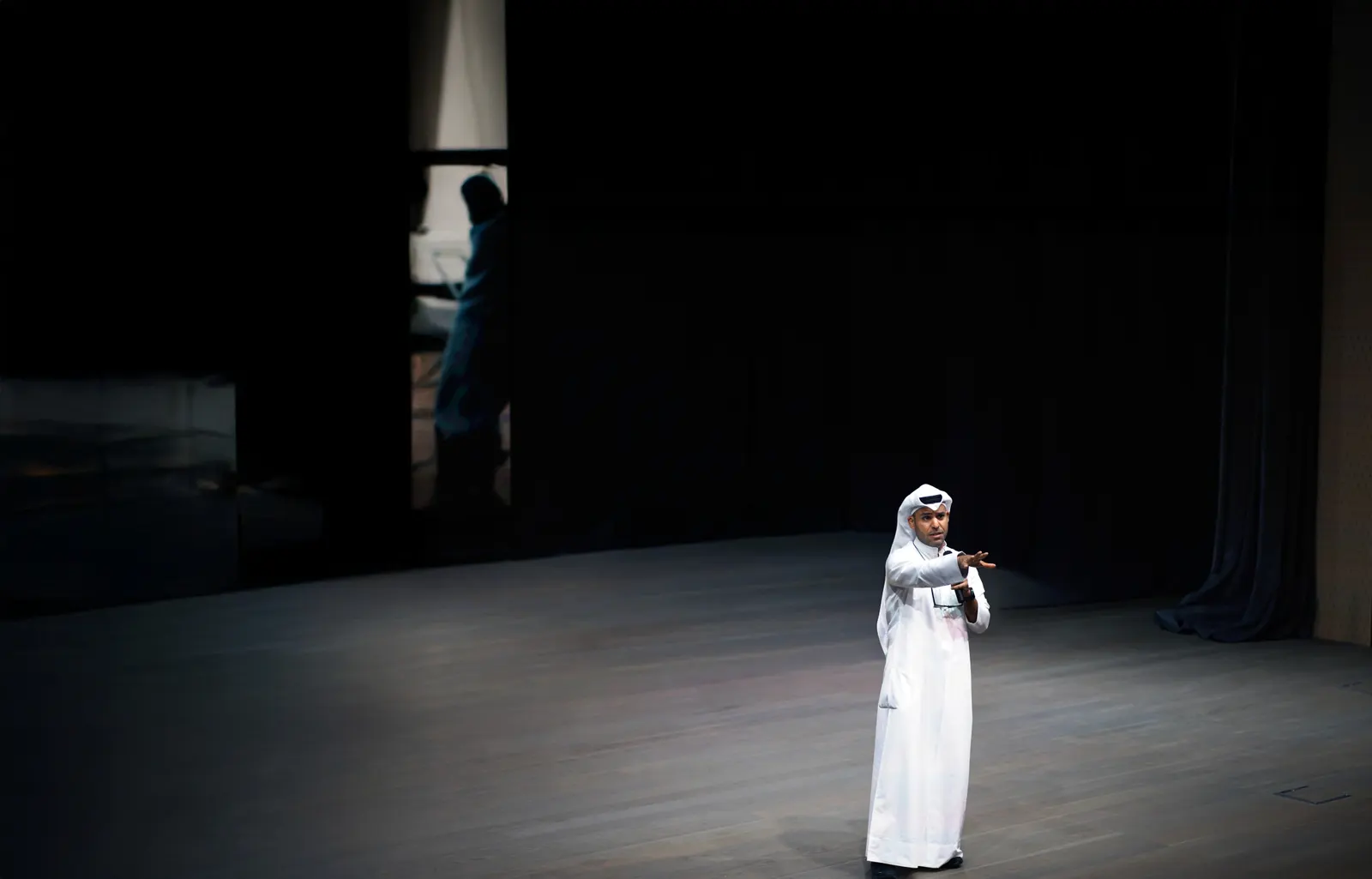 Omar AL Othman speaking on stage